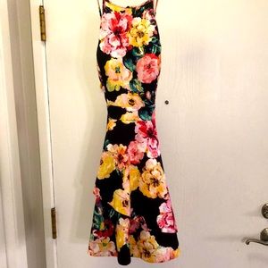 Great cocktail or wedding guest dress. Color is black with floral print.